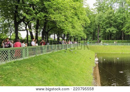 St. Petersburg, Russia - 18 June, Fence near the pond, 18 June, 2017.
Walking through the Summer Garden of St. Petersburg in cloudy, rainy weather.