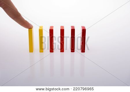 Colorful Domino Blocks in a line on a white background