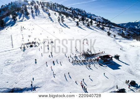 Aerial View Of Skiers At Ski Resort Vasilitsa In The Mountain Range Of Pindos, In Greece.