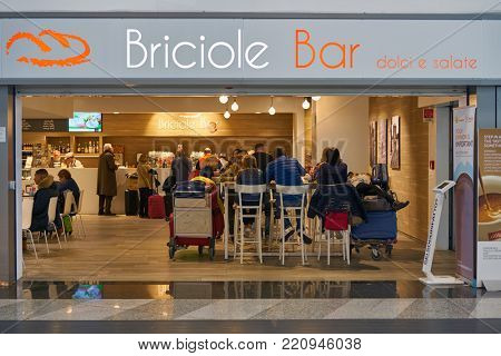 MILAN MALPENSA, ITALY - CIRCA NOVEMBER, 2017: people at Briciole Bar in Milan-Malpensa airport.