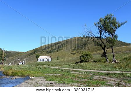 Taiga Village Generalka In The Mountains Of The Altai Territory.western Siberia. Russia