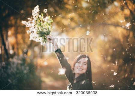 Dreamy Beautiful Girl In White Fluff On Bokeh Background With Yellow Leaves In Golden Sunlight. Insp