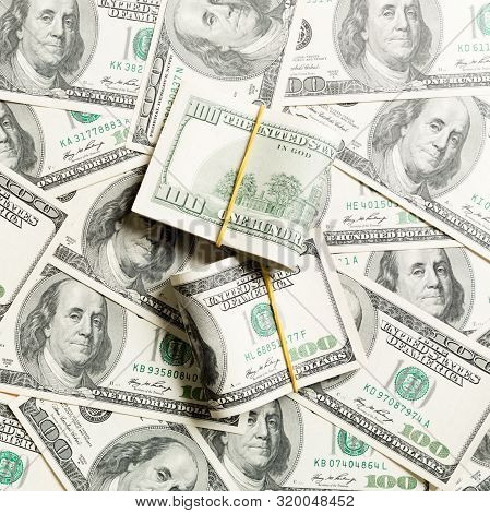 Stacks Of One Hundred Dollars Banknotes Close-up On Dollar Background Business Concept Top View With