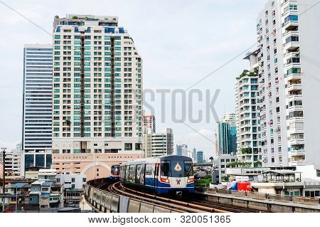 Bangkok, Thailand - August 11 2019: Bts Or Bangkok Skytrain Drive Through The Office Building Or Res
