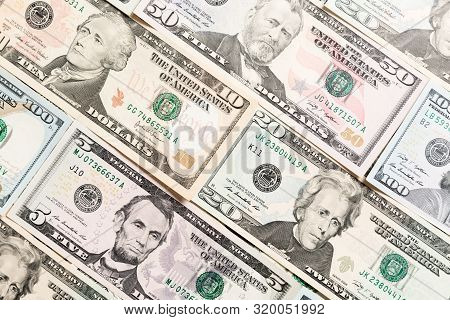 Close Up Of Different Dollar Bills As A Background. Amarican Dollars Pattern. Top View Of Business C