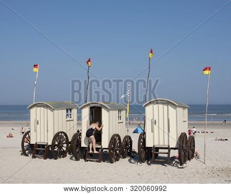 Norderney, Germany, 25 August 2019: Old Fashioned Bathing Carts Used For Changing On Sunny Beach Of 