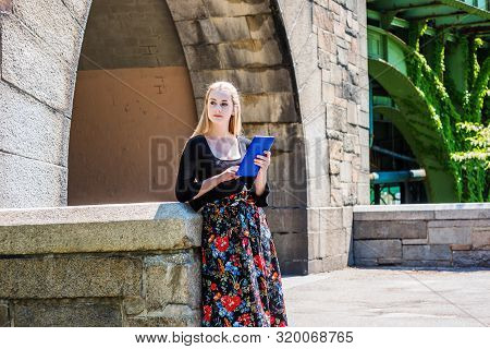 Modern Reading. American Teenage College Student Wearing Black Long Sleeve T Shirt, Patterned Skit, 
