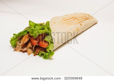 Isolated Shawarma With A Shadow. Oriental Food Made From Chicken Meat, Tomatoes, Cucumbers In Pita B