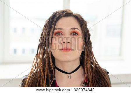 Dreadlocks, Hairdresser And Style Concept - A Stylish Girl With Dreadlocks And In Leather Jacket And