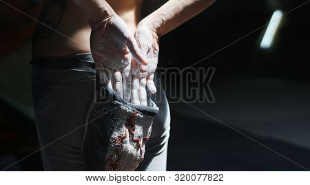Woman Climber Is Chalking Hands With White Chalk Powder Before Climb In Indoor Climbing Gym. Woman G