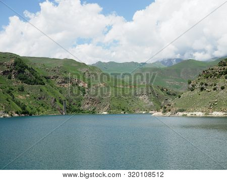 Beautiful Landscape Overlooking The Blue Lake In The Mountains. Lake Giggit In The Region Of Elbrus