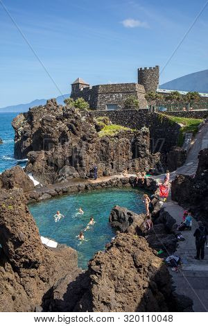 Porto Moniz, Madeira, Portugal - April 18, 2018: Natural Rock Pool Of Porto Moniz On Madeira Island.