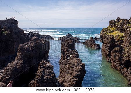 Porto Moniz, Madeira, Portugal - April 18, 2018: Natural Rock Pool Of Porto Moniz On Madeira Island.