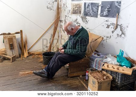 Camacha, Madeira, Portugal - April 19, 2018: A Basket Weaver At Work In The Factory Shop In Camacha 