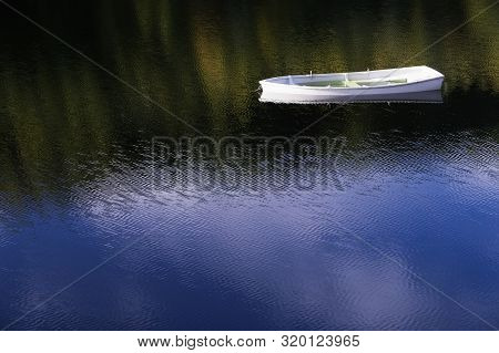 White Angelic Single Lonely Boat Floating Peaceful Bliss Mindfulness In Calm Water With Blue Sky Ref