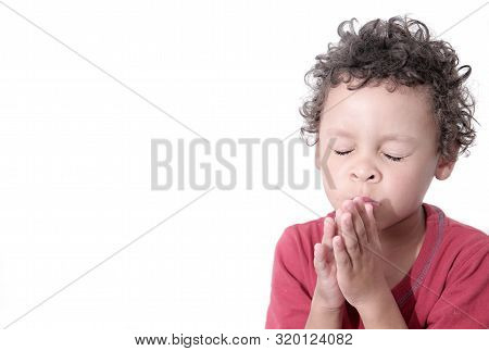 Boy Praying To God Stock Image With Hands Held Together With Closed Eyes Stock Photo