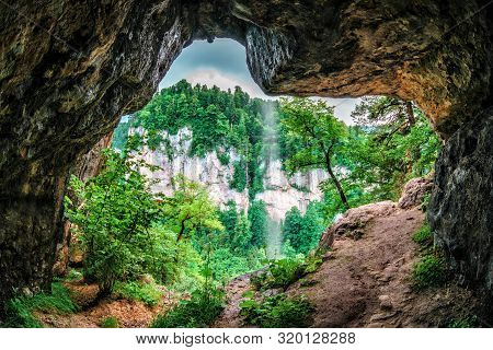 Beautiful Scenic Summer Landscape Of Kurdzhips Gorge Viewed From Inside Rocky Grotto With Waterfall 