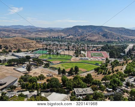 Aerial View Of Small Neighborhood With Dry Desert Mountain On The Background In Moorpark, Ventura Co
