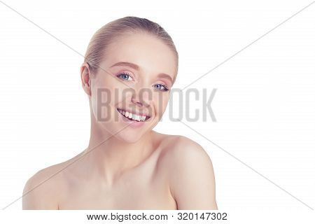 Portrait Of Beautiful Woman With Natural Make Up Touching Her Face.