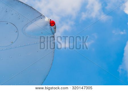 Running Light On Wing Tip Of Military Aircraft With Beautiful Blue Sky In Background.