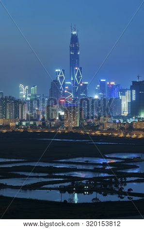 Skyline Of Shenzhen City, China At Twilight. Viewed From Hong Kong Border