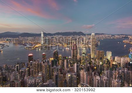 Victoria Harbor Of Hong Kong City At Dusk
