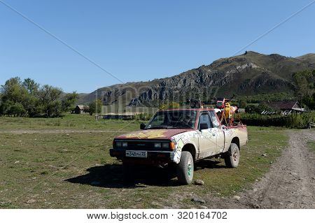 Altai Region, Russia - September 6, 2018:japanese Datsun Pickup Truck 720 In A Mountain Village Chin