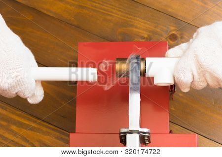 Close-up Of A Screwdriver, Tightens The Fastening Screws For Laying Polypropylene Pipes