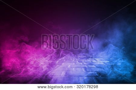 Empty Background Scene. Dark Reflection Of The Street On The Wet Asphalt. Rays Of Blue And Red Neon 