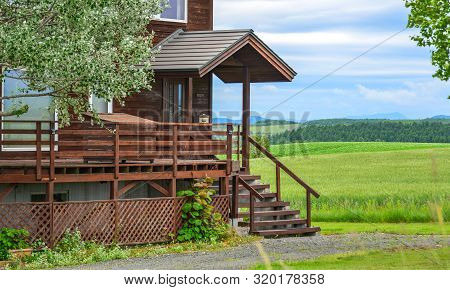 Rural House At Summer Day In Furano, Japan