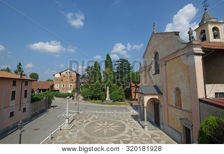 Main Square Aerial View Church And Ancient Castle In Vaprio, Piedmont, Italy