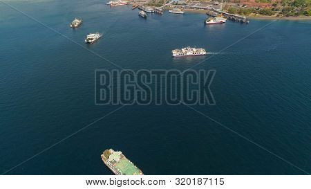 Aerial View Ferry Port Gilimanuk With Ferry Boats, Vehicles. Ferries Transport Vehicles And Passenge
