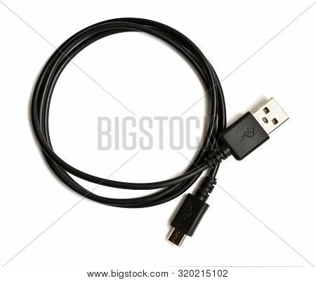 Coiled Black Usb Cable Isolated Over White Background. Top View. There Is A Usb Icon On The Plug. Us