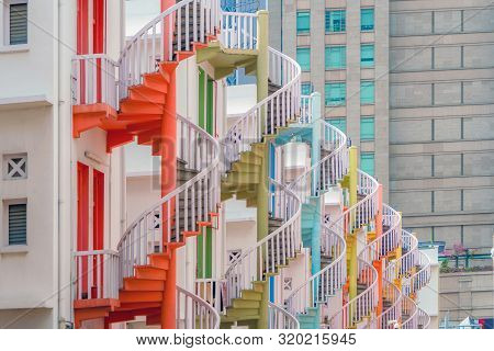 Close Up Of Colorful Pastel Spiral Staircases In Singapore, Bugis Village, Vintage Style Fire Exit O