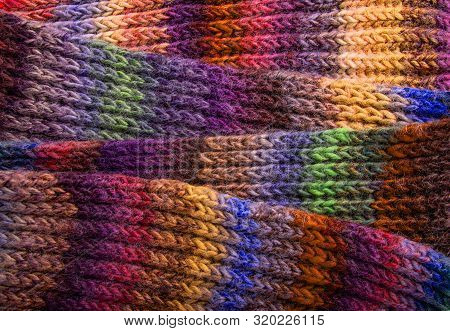 Winter Multi-colored Woolen Shaf As A Background.