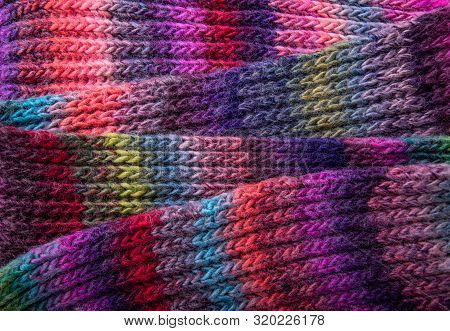 Winter Multi-colored Woolen Shaf As A Background.