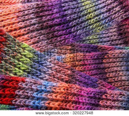 Winter Multi-colored Woolen Shaf As A Background.