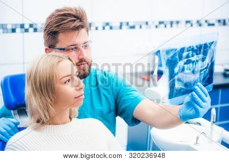 Doctor showing x-ray  to patient