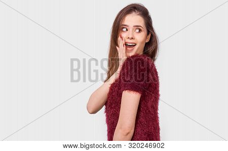 Portrait Of Amazed Beautiful Young Woman Looking At The Camera With Surprised Expression. Pretty Con