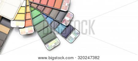 Watercolor paint rainbow palette on white background. Flat lay. Top view.. Horizontal long poster, greeting cards, web site, banner, invitation.