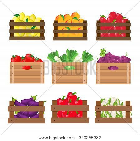 Set Of Fruits And Vegetables In Wooden Crates On White Background