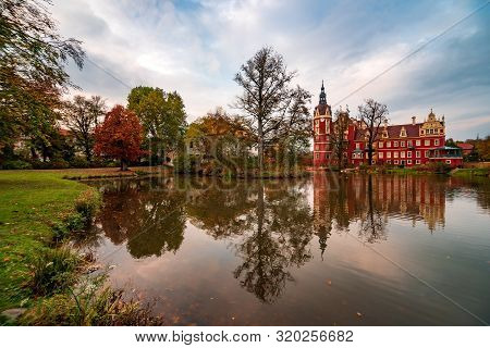 Picturesque Scenery Of Muskau Castle In Famous Muskau Park At Autumn Evening, Germany. Unesco World 