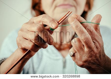 Wool. Woolen Clothes. Hands Of Old Woman Knitting Wool. Adult Activity And Hand Craft. Sweet Mature 