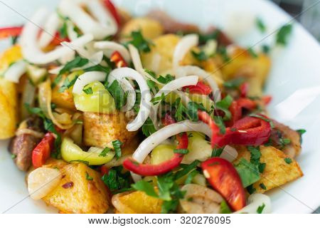 Roasted Meat With Potatoes, Ojaxuri, Hot In Georgian On A Wooden Table. Top View
