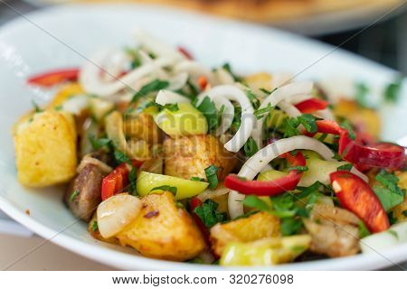Roasted Meat With Potatoes, Ojaxuri, Hot In Georgian On A Wooden Table. Top View