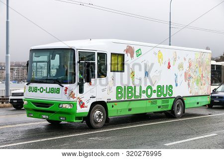 Geneva, Switzerland - March 13, 2019: White Bibli-o-bus In The City Street.