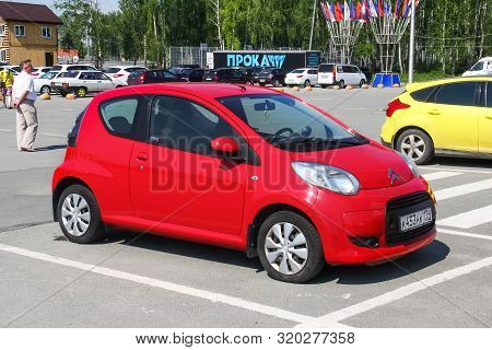 Chelyabinsk, Russia - May 28, 2016: Red Compact Car Citroen C1 In The City Street.