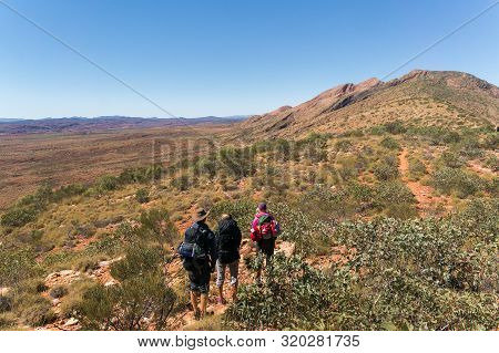 A Group Of Hikers On The Way To The Top Of Mount Sonder Just Outside Alice Springs, West Macdonnel N