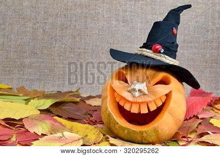 Pumpkin For Halloween Carved In The Shape Of A Smile. Jack Lantern Head Carved From Pumpkin For Hall