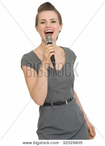 Happy Woman Singing In Microphone Isolated